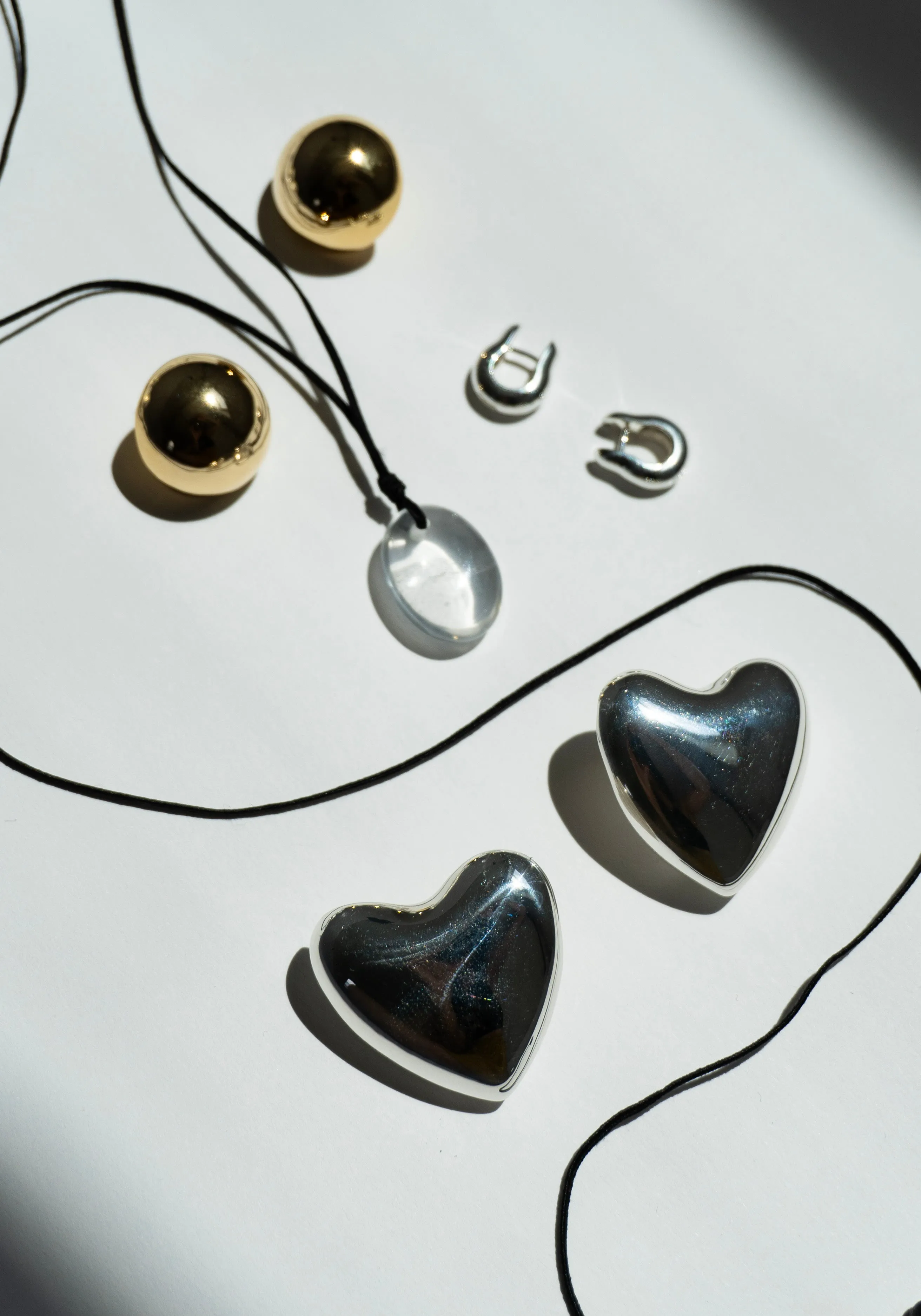 Voluptuous Heart Earrings in Silver