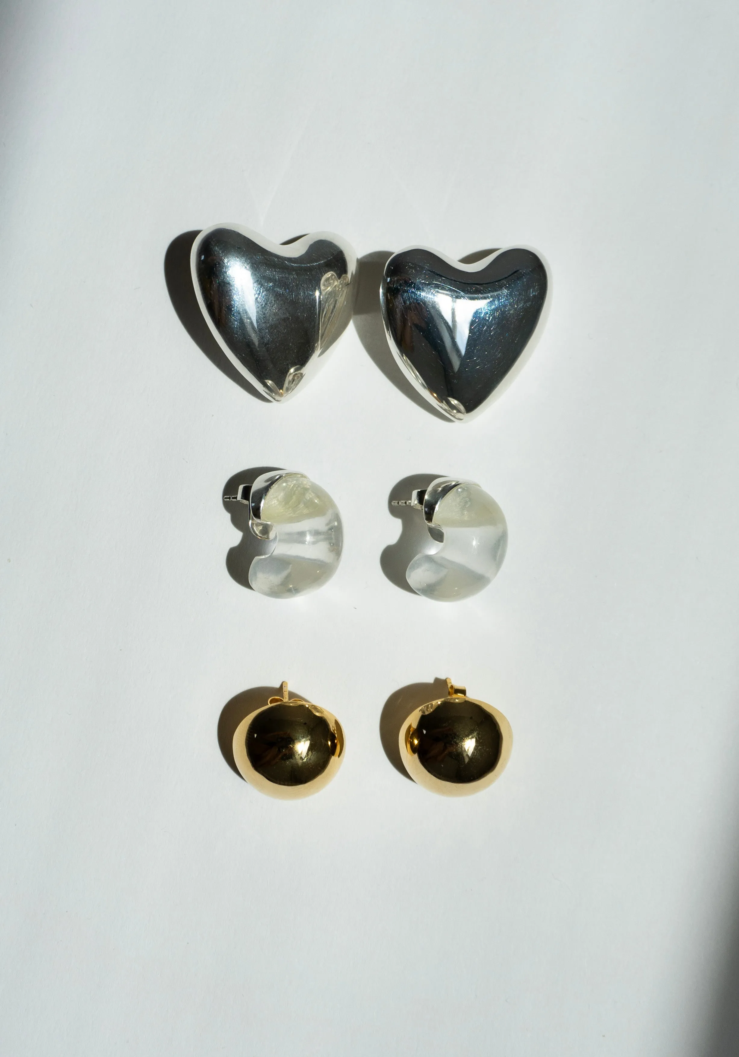 Voluptuous Heart Earrings in Silver