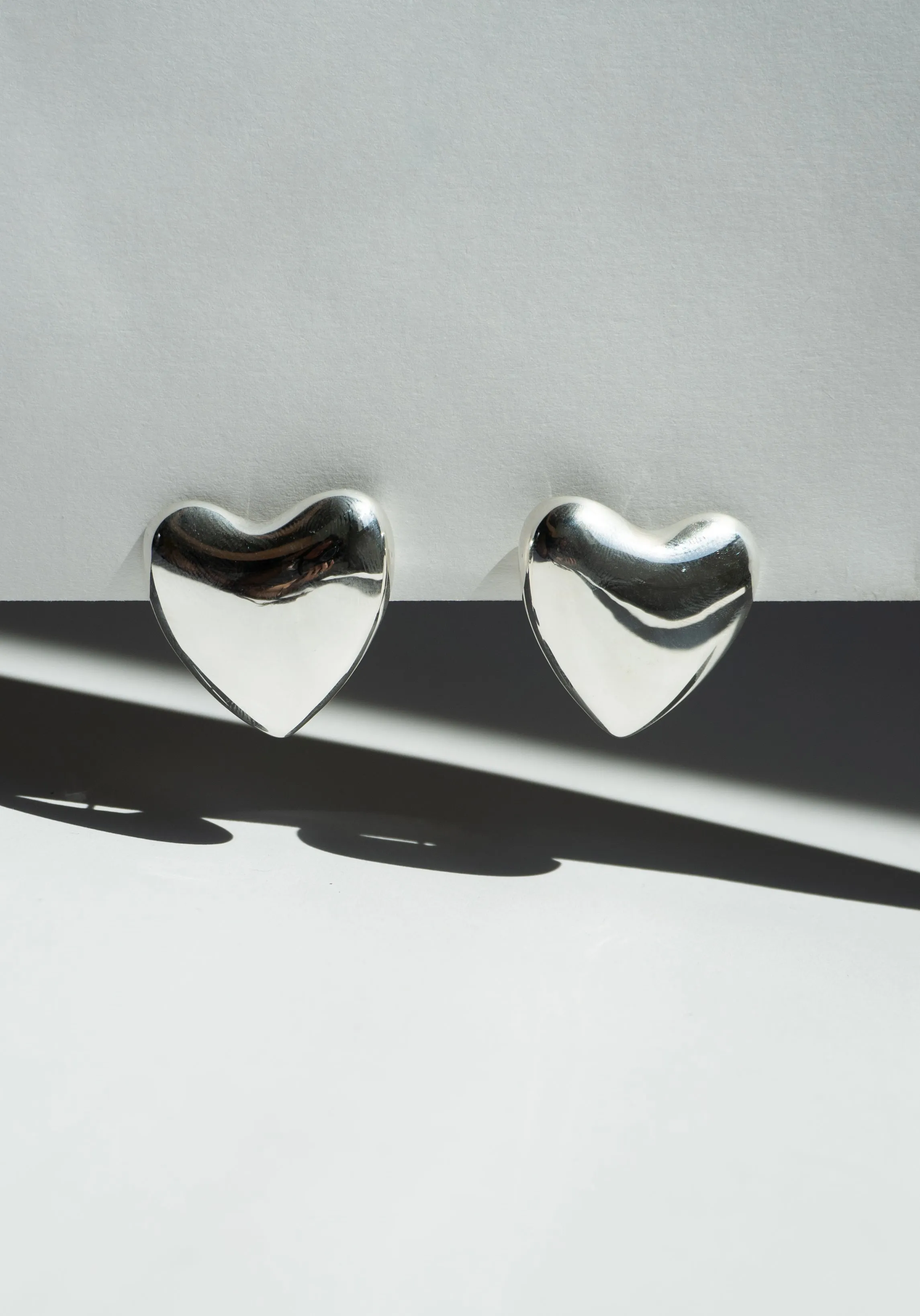 Voluptuous Heart Earrings in Silver